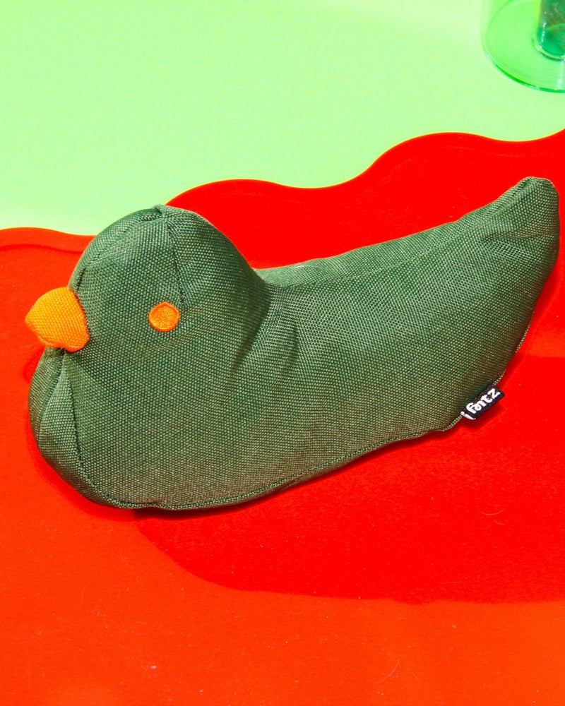 Moss green bird-shaped plush dog toy with an orange beak