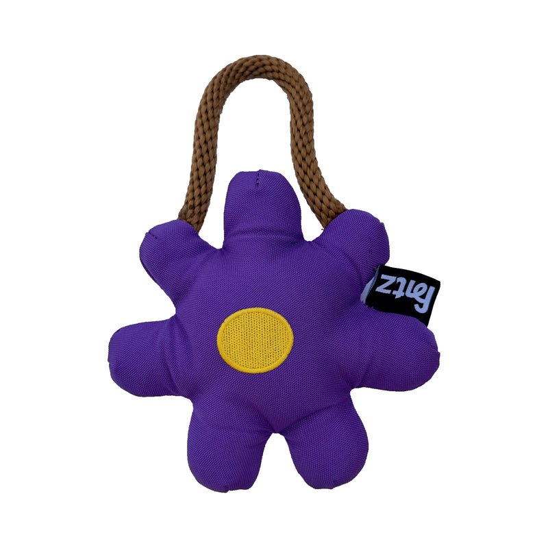 The Daisy Dog Toy: purple flower-shaped tug toy with a cotton rope handle